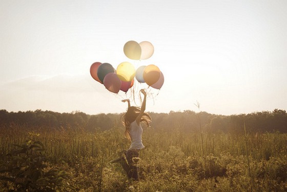 Alone-happy-girl-with-balloon-sunset-jump