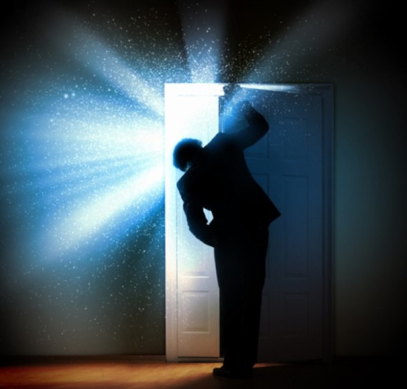 man-opening-door-to-bright-light